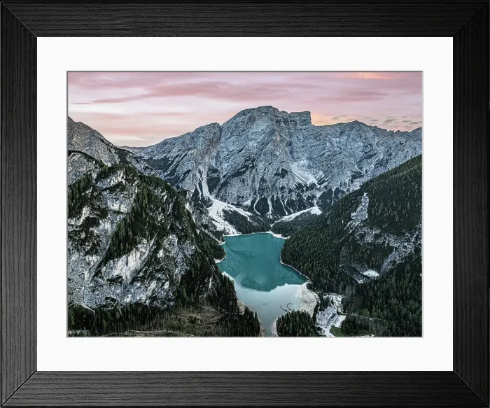 Framed Print : Aerial view of the idyllic lake Braies / Pragser Wildsee under a pink sky at sunset in autumn, Dolomites, South Tyrol, Italy Framed Print : Aerial view of the idyllic lake Braies / Pragser Wildsee under a pink sky at sunset in autumn, Dolomites, South Tyrol, Italy