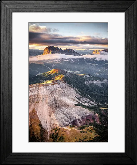 Framed Print : Aerial view of woods of Val Gardena with Sassolungo and Seceda emerging from autumn mist, Dolomites, South Tyrol, Italy Framed Print : Aerial view of woods of Val Gardena with Sassolungo and Seceda emerging from autumn mist, Dolomites, South Tyrol, Italy