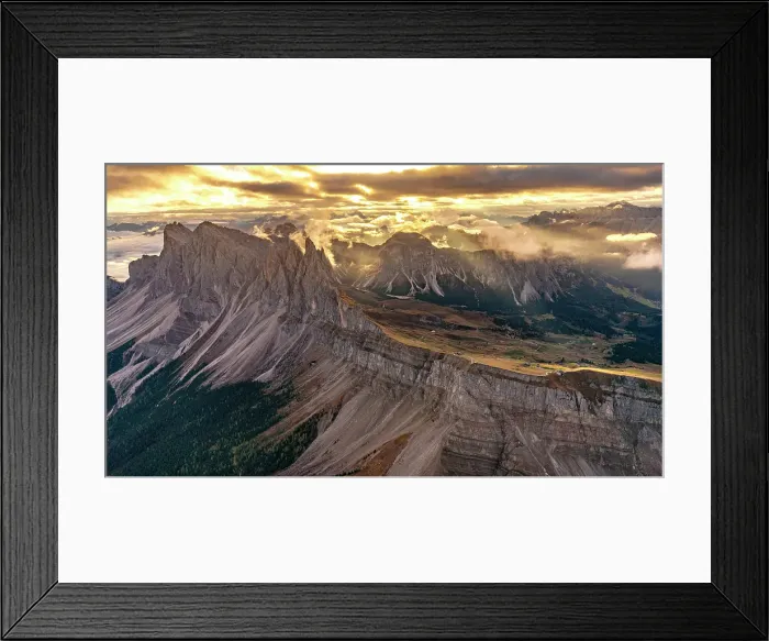 Framed Print : Golden sunset and mist over Furchetta, Sass Rigais and Seceda mountains, aerial view, Puez Odle Natural Park, Dolomites, Italy