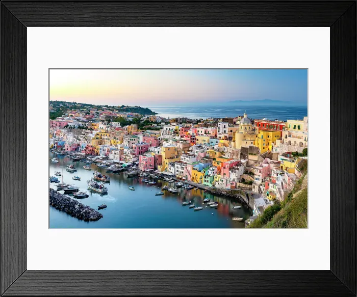 Framed Print : Romantic sunset over the colorful facades and harbor of Procida island, Gulf of Naples, Campania, Italy Framed Print : Romantic sunset over the colorful facades and harbor of Procida island, Gulf of Naples, Campania, Italy