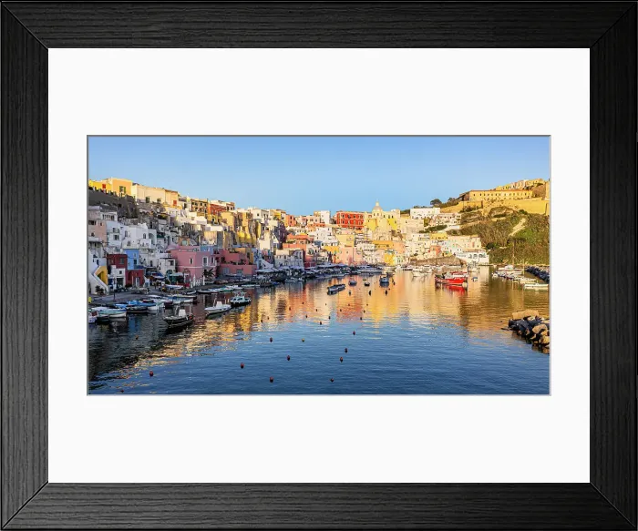 Framed Print : Colorful houses in the fishing village of La Corricella at sunset, Procida island, Gulf of Naples, Campania, Italy Framed Print : Colorful houses in the fishing village of La Corricella at sunset, Procida island, Gulf of Naples, Campania, Italy