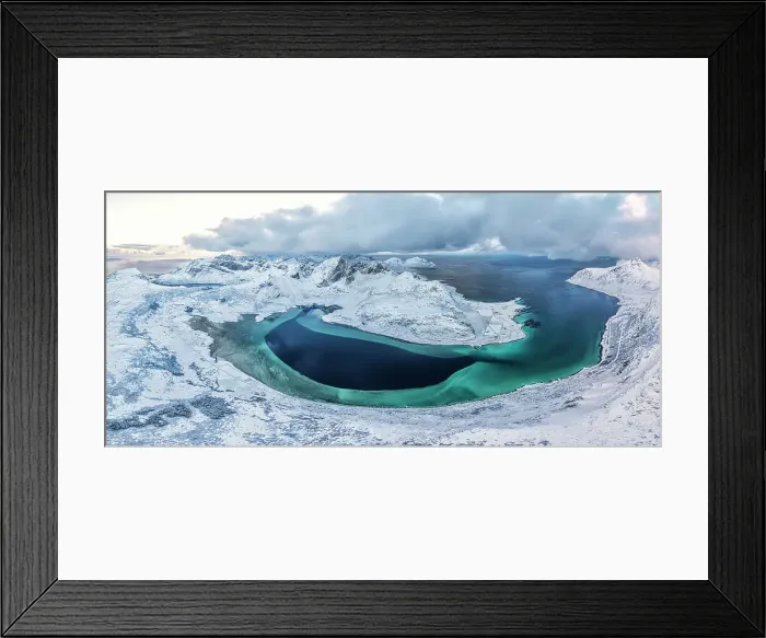 Framed Print : Panoramic aerial view of snowcapped mountains along a blue frozen fjord, Flakstad Pollen, Lofoten Islands, Nordland, Norway Framed Print : Panoramic aerial view of snowcapped mountains along a blue frozen fjord, Flakstad Pollen, Lofoten Islands, Nordland, Norway