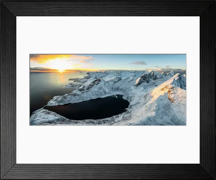 Framed Print : Snowcapped mountains and icy fjord lit by the warm arctic sunset in winter, Reine, Lofoten Islands, Norway Framed Print : Snowcapped mountains and icy fjord lit by the warm arctic sunset in winter, Reine, Lofoten Islands, Norway
