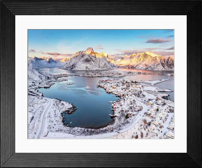 Framed Print : Aerial view of the snowy fishing village of Reine with Olstind mountain on background, Lofoten Islands, Norway Framed Print : Aerial view of the snowy fishing village of Reine with Olstind mountain on background, Lofoten Islands, Norway