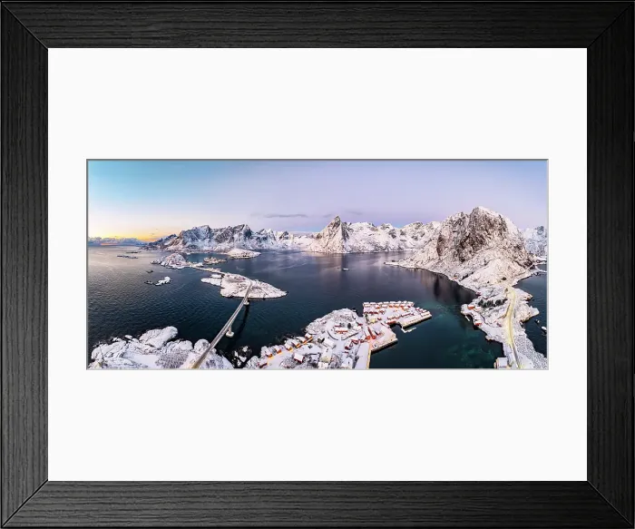 Framed Print : Aerial view of snowcapped Reinebringen mountain overlooking Reine Bay and the cold arctic sea, Reine, Lofoten Islands, Norway Framed Print : Aerial view of snowcapped Reinebringen mountain overlooking Reine Bay and the cold arctic sea, Reine, Lofoten Islands, Norway