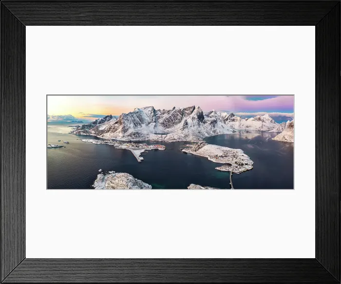 Framed Print : Aerial view of the snowy Reinebringen mountain and Reine Bay under scenic clouds at dawn, Reine, Lofoten Islands, Norway Framed Print : Aerial view of the snowy Reinebringen mountain and Reine Bay under scenic clouds at dawn, Reine, Lofoten Islands, Norway