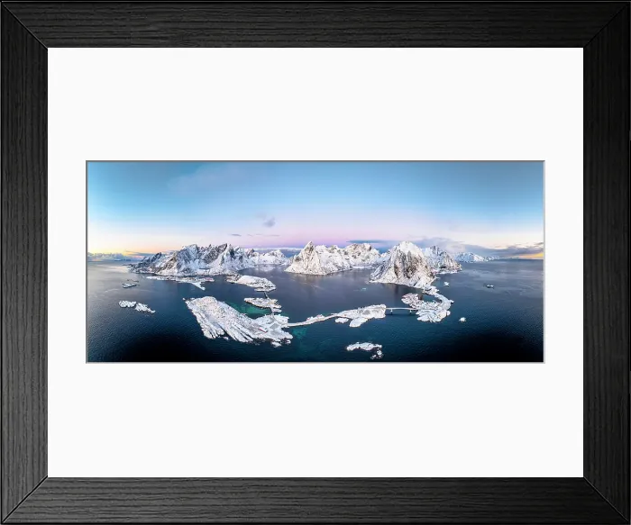 Framed Print : Aerial panoramic view of snowcapped mountains and Reine Bay facing the icy sea in winter, Reine, Lofoten Islands, Norway Framed Print : Aerial panoramic view of snowcapped mountains and Reine Bay facing the icy sea in winter, Reine, Lofoten Islands, Norway