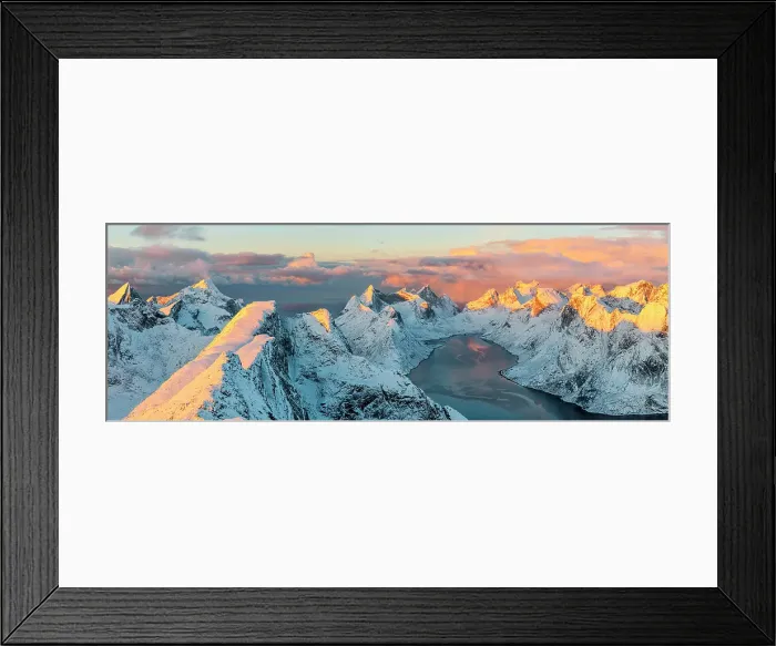 Framed Print : Aerial view of snowy peaks and frozen fjord at sunset, Reine, Lofoten Islands, Norway