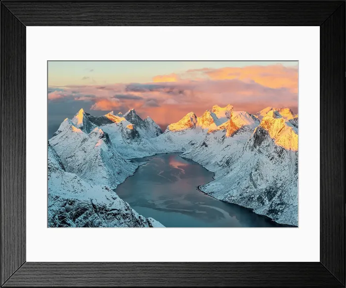 Framed Print : Burning sky at sunset over snowy mountains overlooking the cold arctic sea in winter, Reine, Lofoten Islands, Norway Framed Print : Burning sky at sunset over snowy mountains overlooking the cold arctic sea in winter, Reine, Lofoten Islands, Norway