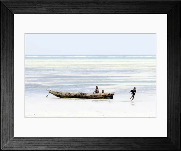 Framed Print : Young local boys playing in a dugout canoe, Zanzibar, Bweju, Tanzania Framed Print : Young local boys playing in a dugout canoe, Zanzibar, Bweju, Tanzania