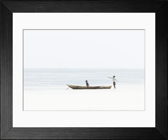 Framed Print : Young local boys playing in a dugout canoe, Zanzibar, Bweju, Tanzania Framed Print : Young local boys playing in a dugout canoe, Zanzibar, Bweju, Tanzania