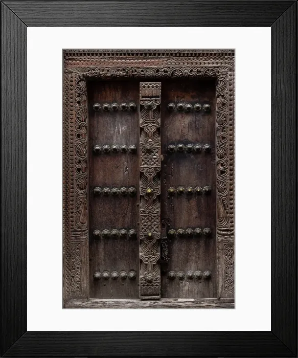 Framed Print : Old heavy carved wooden door, Stonetown, Zanzibar, Tanzania Framed Print : Old heavy carved wooden door, Stonetown, Zanzibar, Tanzania