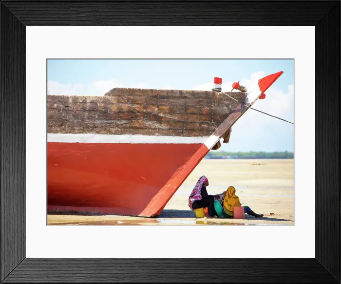 Framed Print : Two women sitting in the shade of a fishing boat on the beach, Mkokotoni, Zanzibar, Tanzania Framed Print : Two women sitting in the shade of a fishing boat on the beach, Mkokotoni, Zanzibar, Tanzania