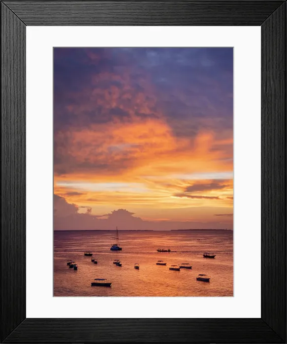 Framed Print : Boats on the sea in silhouette at sunset, Nungwi, Zanzibar, Tanzania Framed Print : Boats on the sea in silhouette at sunset, Nungwi, Zanzibar, Tanzania
