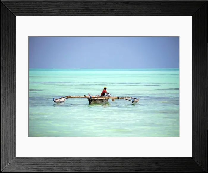 Framed Print : Local fisherman bailing out his old wooden dhow, Nungwi, Zanzibar, Tanzania Framed Print : Local fisherman bailing out his old wooden dhow, Nungwi, Zanzibar, Tanzania