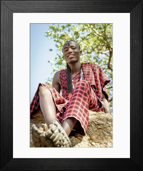 Framed Print : africa, Tanzania, Manyara Region. A handsome maasai warrior sitting on a rock Framed Print : africa, Tanzania, Manyara Region. A handsome maasai warrior sitting on a rock