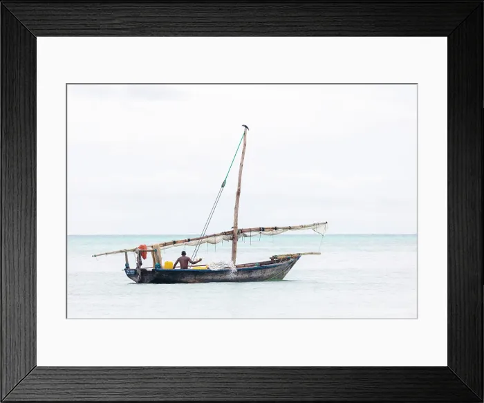 Framed Print : Fisherman on his traditional dhow, Nungwi, Zanzibar, Tanzania Framed Print : Fisherman on his traditional dhow, Nungwi, Zanzibar, Tanzania