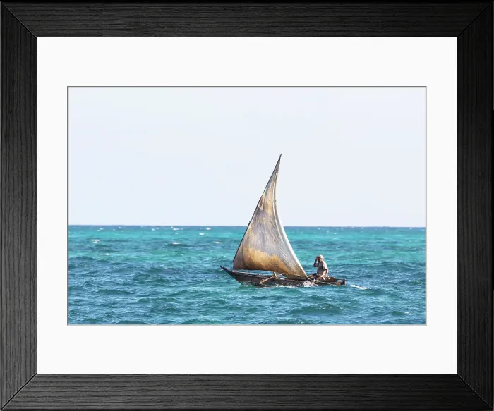 Framed Print : Local fisherman on a small traditional dhow heading out to sea, Nungwi, Zanzibar, Tanzania Framed Print : Local fisherman on a small traditional dhow heading out to sea, Nungwi, Zanzibar, Tanzania