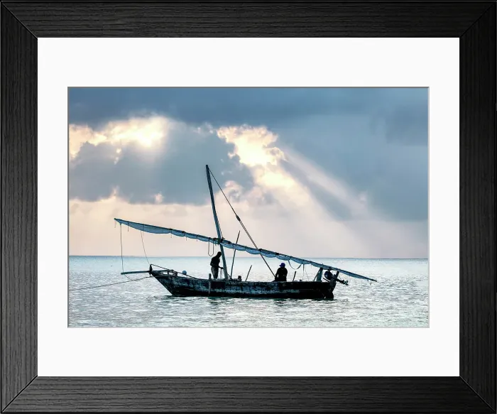 Framed Print : Two local fishermen on their traditional dhow at sunrise, Jambiani, Zanzibar, Tanzania