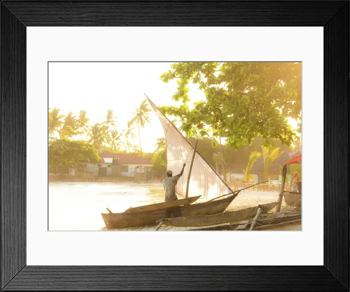Framed Print : Man hoisting the sail of his dhow, Nungwi, Zanzibar, Tanzania Framed Print : Man hoisting the sail of his dhow, Nungwi, Zanzibar, Tanzania