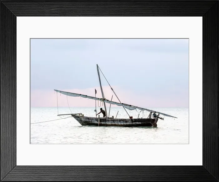 Framed Print : Two local fisherman on his traditional dhow at sunrise, Jambiani, Zanzibar, Tanzania Framed Print : Two local fisherman on his traditional dhow at sunrise, Jambiani, Zanzibar, Tanzania