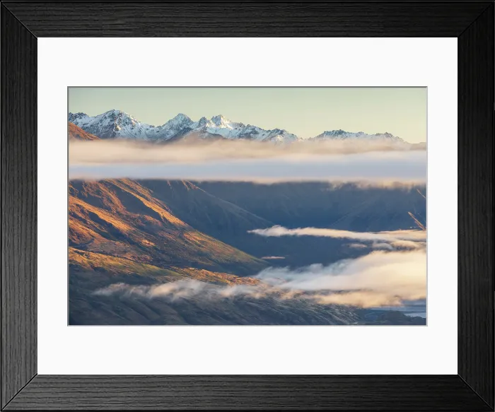 Framed Print : Low clouds hang beneath the Southern Alps near Wanaka, South Island, New Zealand. Autumn (May) 2025