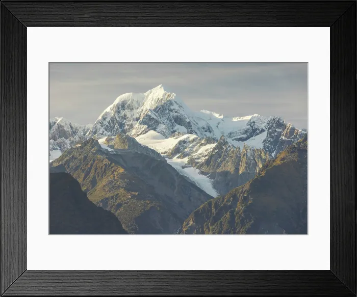 Framed Print : Mount Tasman, the second highest mountain in New Zealand, photographed from Lake Matheson, South Island, New Zealand. Autumn (May) 2025