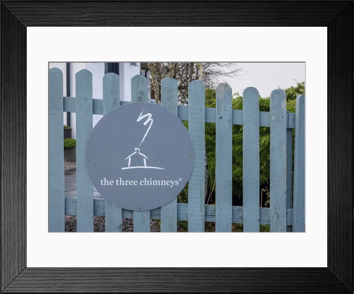 Framed Print : Sign for the famous Three Chimneys Restaurant at Colbost on the Isle of Skye, Scotland. Winter (February) 2025