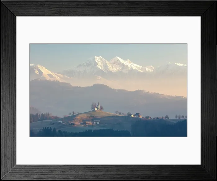 Framed Print : Church of St. Thomas and the Kamink Savinja Alps in winter, Skofja Loka, Slovenia Framed Print : Church of St. Thomas and the Kamink Savinja Alps in winter, Skofja Loka, Slovenia