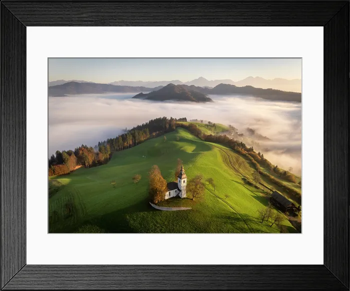 Framed Print : Aerial view of the Church of St. Thomas and the Kamink Savinja Alps in autumn, Skofja Loka, Slovenia Framed Print : Aerial view of the Church of St. Thomas and the Kamink Savinja Alps in autumn, Skofja Loka, Slovenia