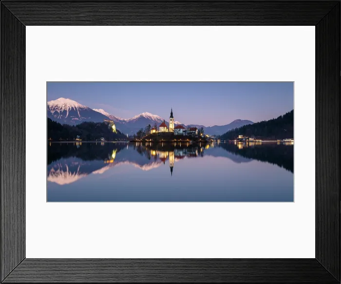 Framed Print : Church of the Assumption of the Blessed Virgin Mary, on Bled island, Lake Bled, at dusk in winter, with the Julian Alps in the distance, Bled, Slovenia