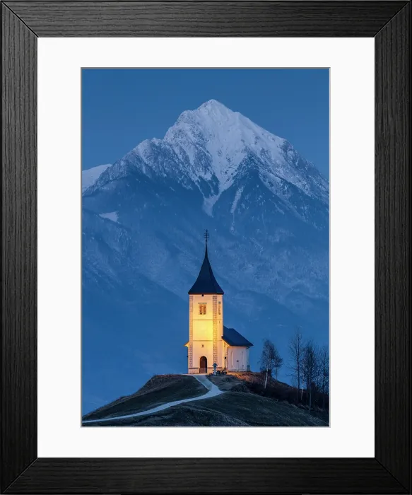 Framed Print : Church of St. Primoz and Felician at dusk in winter, with the Kamnik-Savinja Alps in the distance, Jamnik, Slovenia Framed Print : Church of St. Primoz and Felician at dusk in winter, with the Kamnik-Savinja Alps in the distance, Jamnik, Slovenia