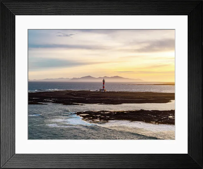 Framed Print : Mist at sunrise over El Toston lighthouse and the rippled sea, El Cotillo, Fuerteventura, Canary Islands, Spain