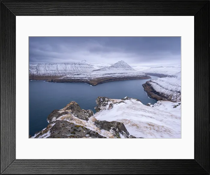 Framed Print : Snow covered mountains surround Funningsfjordur on the island of Eysturoy in the Faroe Islands Framed Print : Snow covered mountains surround Funningsfjordur on the island of Eysturoy in the Faroe Islands