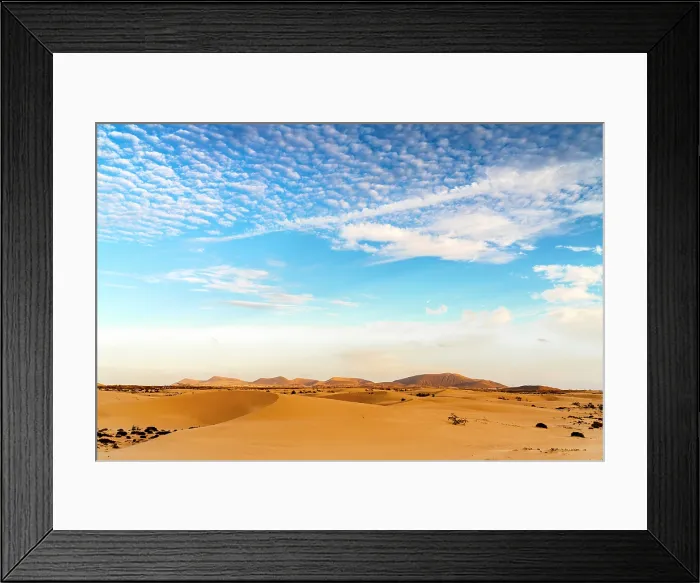 Framed Print : Scenic clouds at dawn over the golden sand dunes of Corralejo Natural Park, Fuerteventura, Canary Islands, Spain