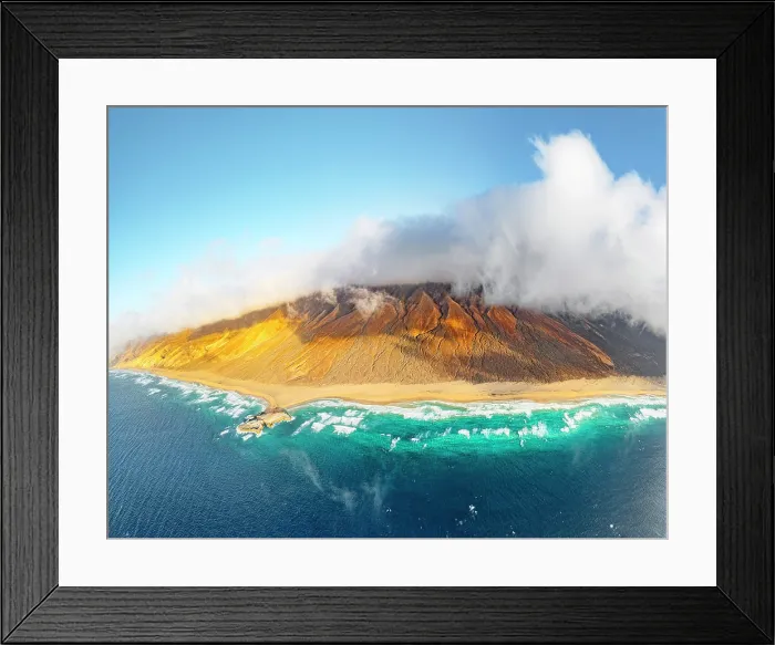 Framed Print : Aerial panoramic of golden sand of Cofete beach washed by the crystal sea, Jandia Natural Park, Fuerteventura, Canary Islands Framed Print : Aerial panoramic of golden sand of Cofete beach washed by the crystal sea, Jandia Natural Park, Fuerteventura, Canary Islands