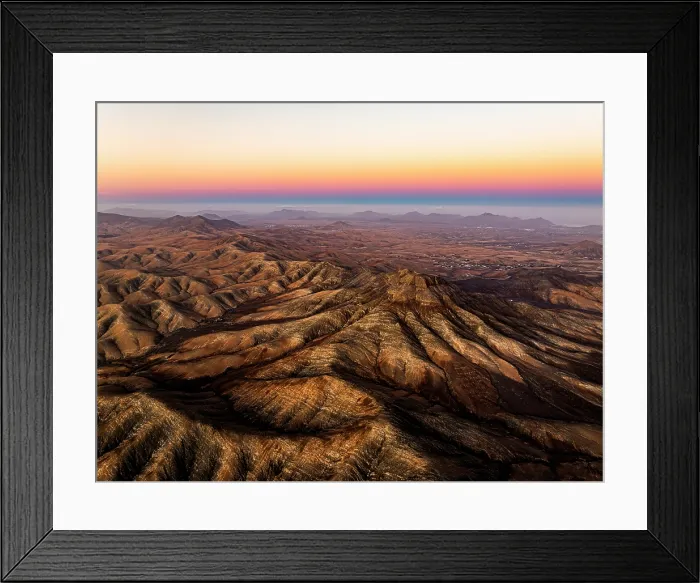 Framed Print : Aerial view of desert mountains and Atlantic Ocean at sunset from Sicasumbre viewpoint, Fuerteventura, Canary Islands, Spain Framed Print : Aerial view of desert mountains and Atlantic Ocean at sunset from Sicasumbre viewpoint, Fuerteventura, Canary Islands, Spain