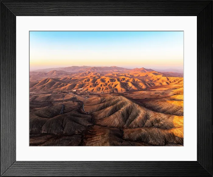 Framed Print : Aerial view of desert mountains and volcanic landscape at sunset from Sicasumbre viewpoint, Fuerteventura, Canary Islands, Spain Framed Print : Aerial view of desert mountains and volcanic landscape at sunset from Sicasumbre viewpoint, Fuerteventura, Canary Islands, Spain
