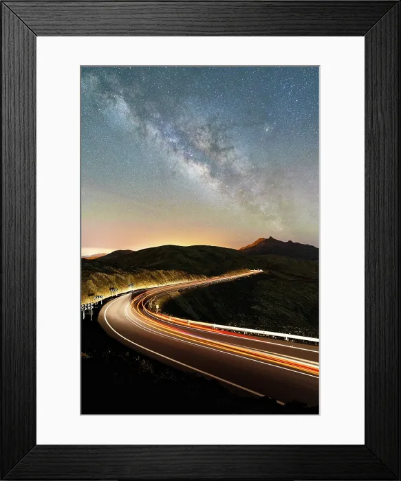 Framed Print : Winding road with lights of car trails in the volcanic landscape under the Milky Way, Fuerteventura, Canary Islands, Spain Framed Print : Winding road with lights of car trails in the volcanic landscape under the Milky Way, Fuerteventura, Canary Islands, Spain