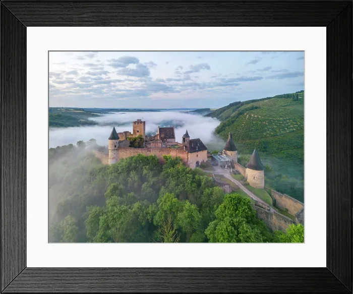 Framed Print : Aerial view at Bourscheid Castle in the Sauer Valley in morning fog, canton Diekirch, Luxembourg Framed Print : Aerial view at Bourscheid Castle in the Sauer Valley in morning fog, canton Diekirch, Luxembourg