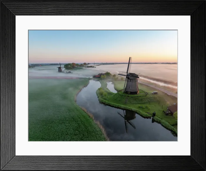 Framed Print : An aerial view of windmills in the mist at dawn, North Holland, Netherlands Framed Print : An aerial view of windmills in the mist at dawn, North Holland, Netherlands