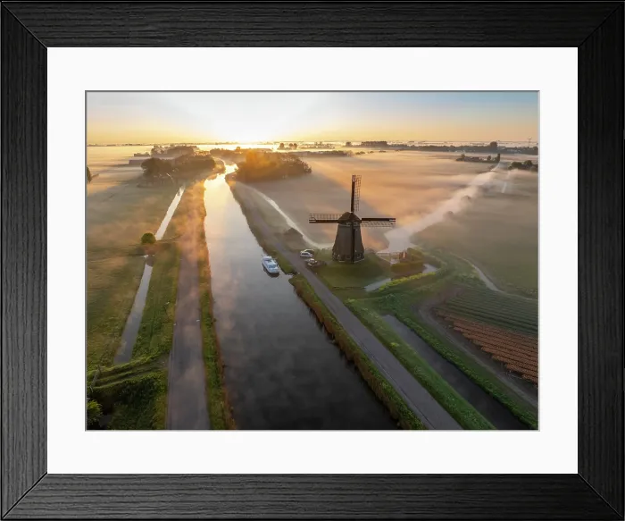 Framed Print : An aerial view of a windmill in the mist at dawn, North Holland, Netherlands Framed Print : An aerial view of a windmill in the mist at dawn, North Holland, Netherlands