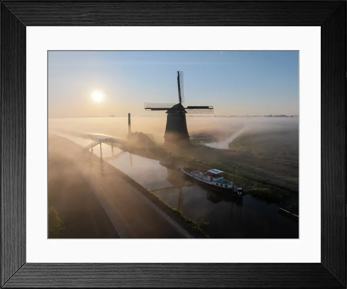 Framed Print : An aerial view of a windmill in the mist at dawn, North Holland, Netherlands Framed Print : An aerial view of a windmill in the mist at dawn, North Holland, Netherlands