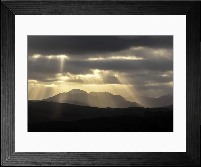 Framed Print : Sun rays over the mountains of Cluanie Forest and Glenquoich Forest viewed from Glen Garry, Highland Region, Scotland, UK, February 2025 Framed Print : Sun rays over the mountains of Cluanie Forest and Glenquoich Forest viewed from Glen Garry, Highland Region, Scotland, UK, February 2025
