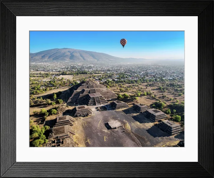 Framed Print : Hot air balloon flying over the Avenue of the Dead and the Pyramid of the Moon at sunrise, aerial view, Teotihuacan, Mexico State, Mexico Framed Print : Hot air balloon flying over the Avenue of the Dead and the Pyramid of the Moon at sunrise, aerial view, Teotihuacan, Mexico State, Mexico