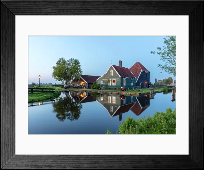 Framed Print : Traditional wooden houses reflected in a canal, Zaanse Schans, North Holland, Netherlands Framed Print : Traditional wooden houses reflected in a canal, Zaanse Schans, North Holland, Netherlands