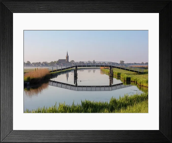 Framed Print : A bridge crosses a canal near Schermerhorn, North Holland, Netherlands