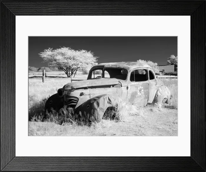 Framed Print : Infrared view of the shell of an old car at the remote settlement of Solitaire, Khomas Region, Namibia Framed Print : Infrared view of the shell of an old car at the remote settlement of Solitaire, Khomas Region, Namibia
