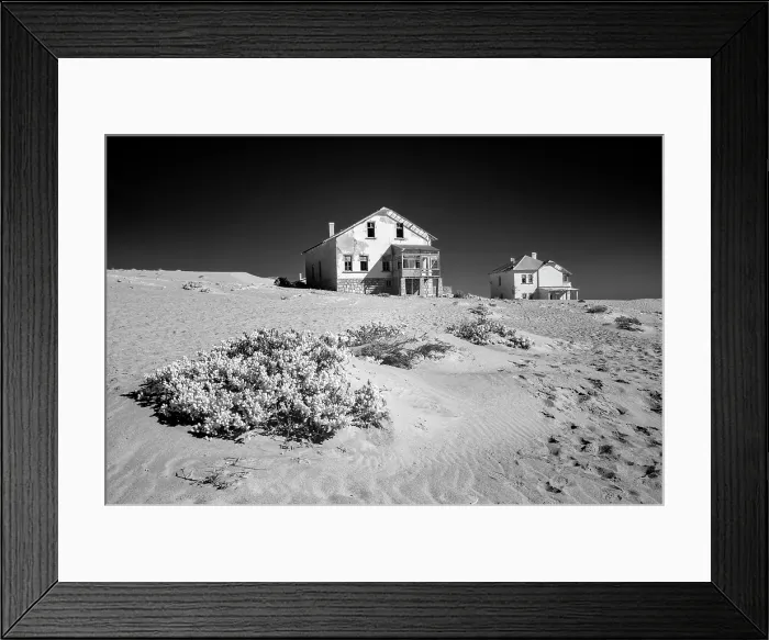 Framed Print : Infrared view of abandoned houses on sand dunes in the former diamond mining town of Kolmanskop, Luderitz, Namib Desert, Namibia Framed Print : Infrared view of abandoned houses on sand dunes in the former diamond mining town of Kolmanskop, Luderitz, Namib Desert, Namibia