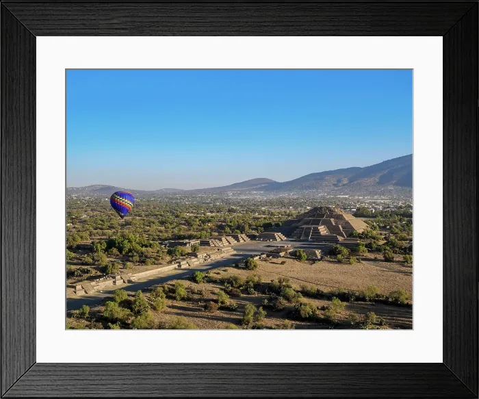 Framed Print : Hot air balloon flying over the Avenue of the Dead and the Pyramid of the Moon at sunrise, aerial view, Teotihuacan, Mexico State, Mexico Framed Print : Hot air balloon flying over the Avenue of the Dead and the Pyramid of the Moon at sunrise, aerial view, Teotihuacan, Mexico State, Mexico